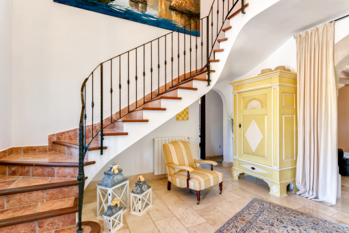 A staircase leads to the upper floor