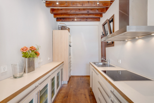 Fitted kitchen with adjoining pantry