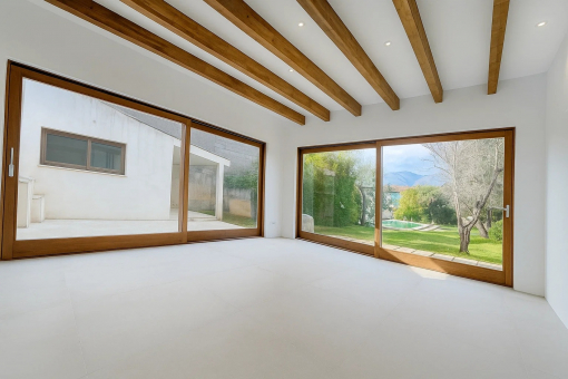 Modern living-dining room with access to the patio