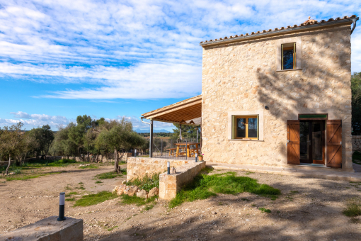 Exterior view of the finca with covered terrace and open countryside views