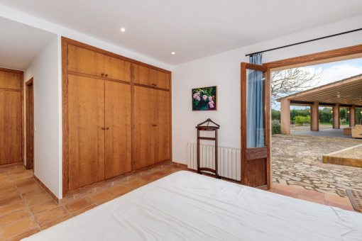 One of the four bedrooms with access to the garden