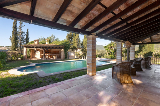 Covered porche with views over the pool and the landscape