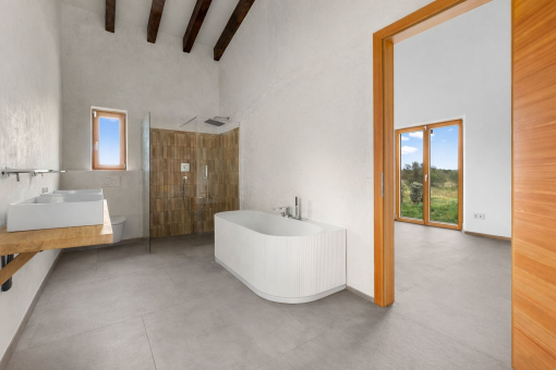 Master bathroom with bathtub and shower