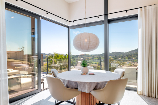 Dining area with panoramic windows and views