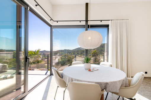 Dining area with panoramic windows and views