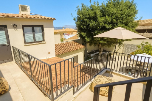 Sunny spacious balcony with garden view