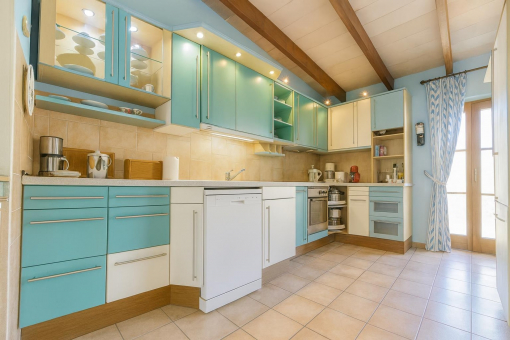 Bright kitchen with blue cabinets