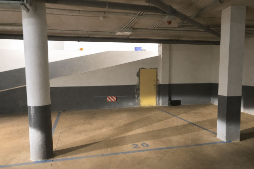 Large underground parking space with adjacent storage room