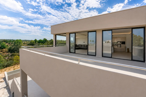 Modern villa façade with a spacious balcony