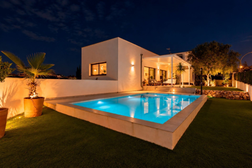 Illuminated Pool Area at Night