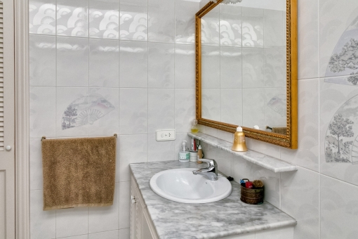 Bright bathroom with elements of marble