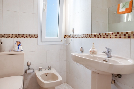 Bright bathroom with large mirror