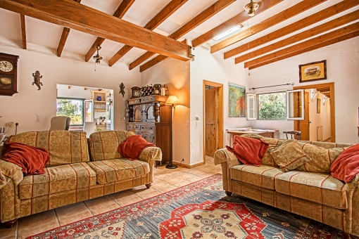Living area with wooden ceiling beams