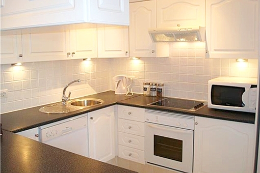 Nice fitted kitchen with electric devices