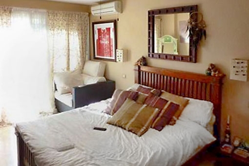 Comfortable double bedroom with large windows