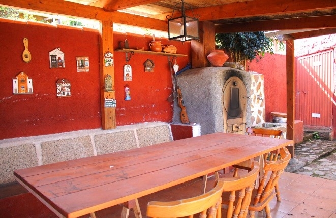 The table and one of the outside ovens
