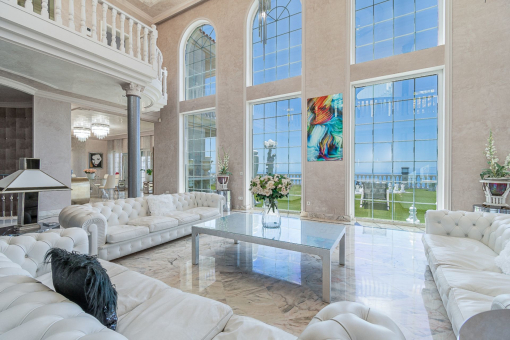 Living area with sea and garden views