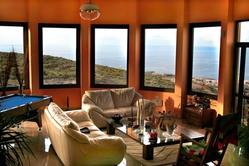 The living room with round panoramic windows and magnificent sea views