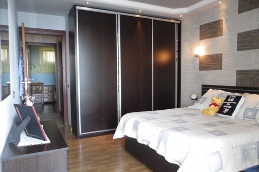 One of the bedrooms with double bed and large wardrobe