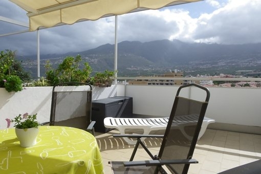 The lovely south facing terrace with stunning views of the mountains