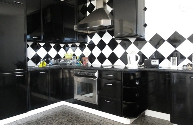 The modern kitchen with ceramic hob and extractor hood