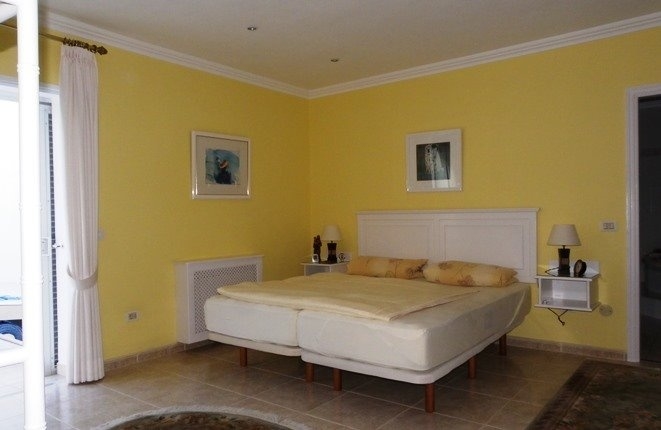 Master bedroom with access to the pool and Ensuite bad