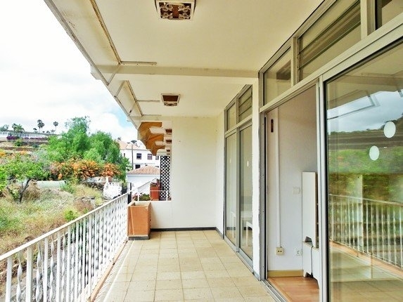 The large protected balcony in front of living room and bed room