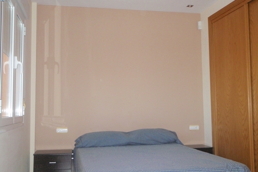 Bedroom with double bed and fitted wardrobe