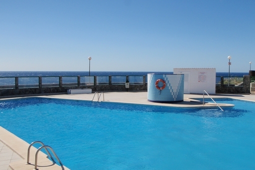Large communal swimming pool with spectacular views