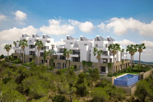 Modern apartments surrounded by palm trees