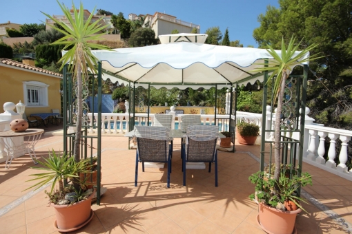 Covered seating area at pool